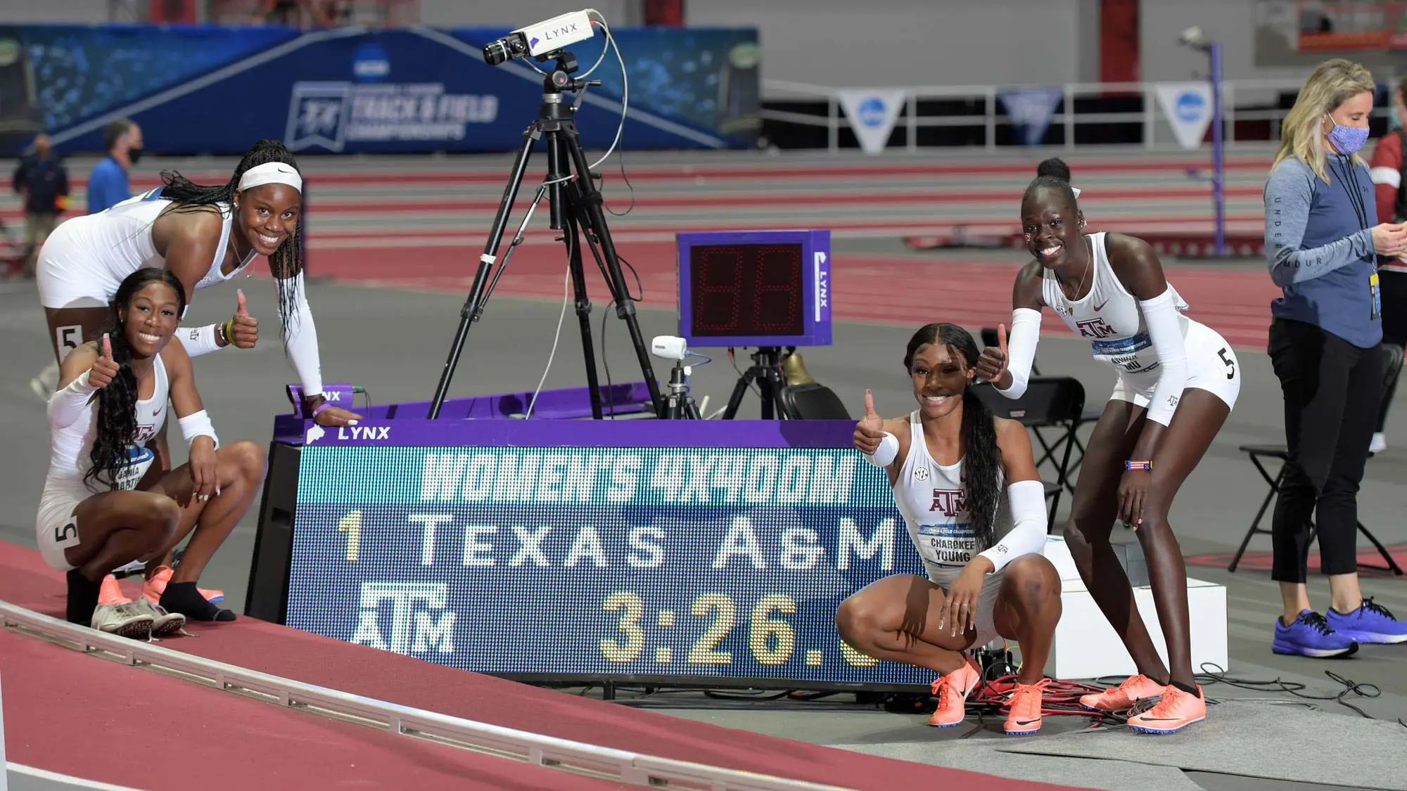 Track and Field teammates giving thumbs up