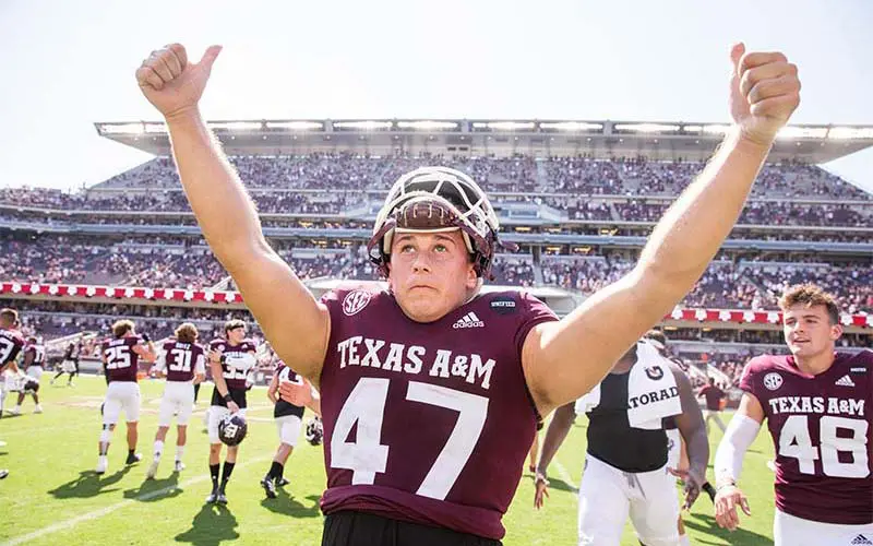 A football player giving thumbs up on the football field