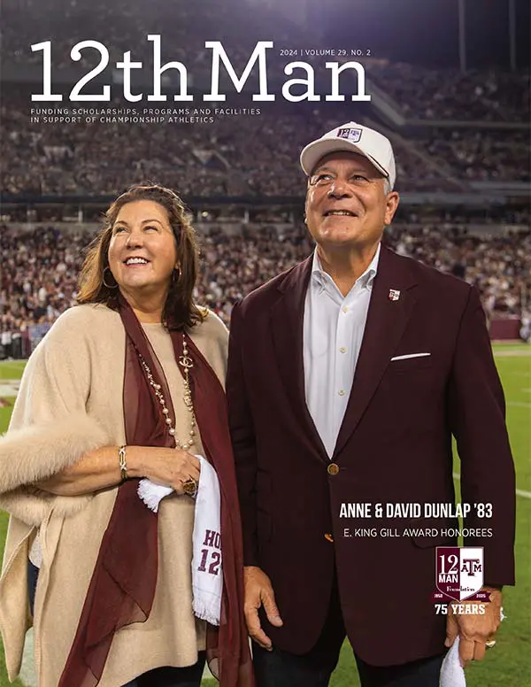 a man and woman on the field at a football game