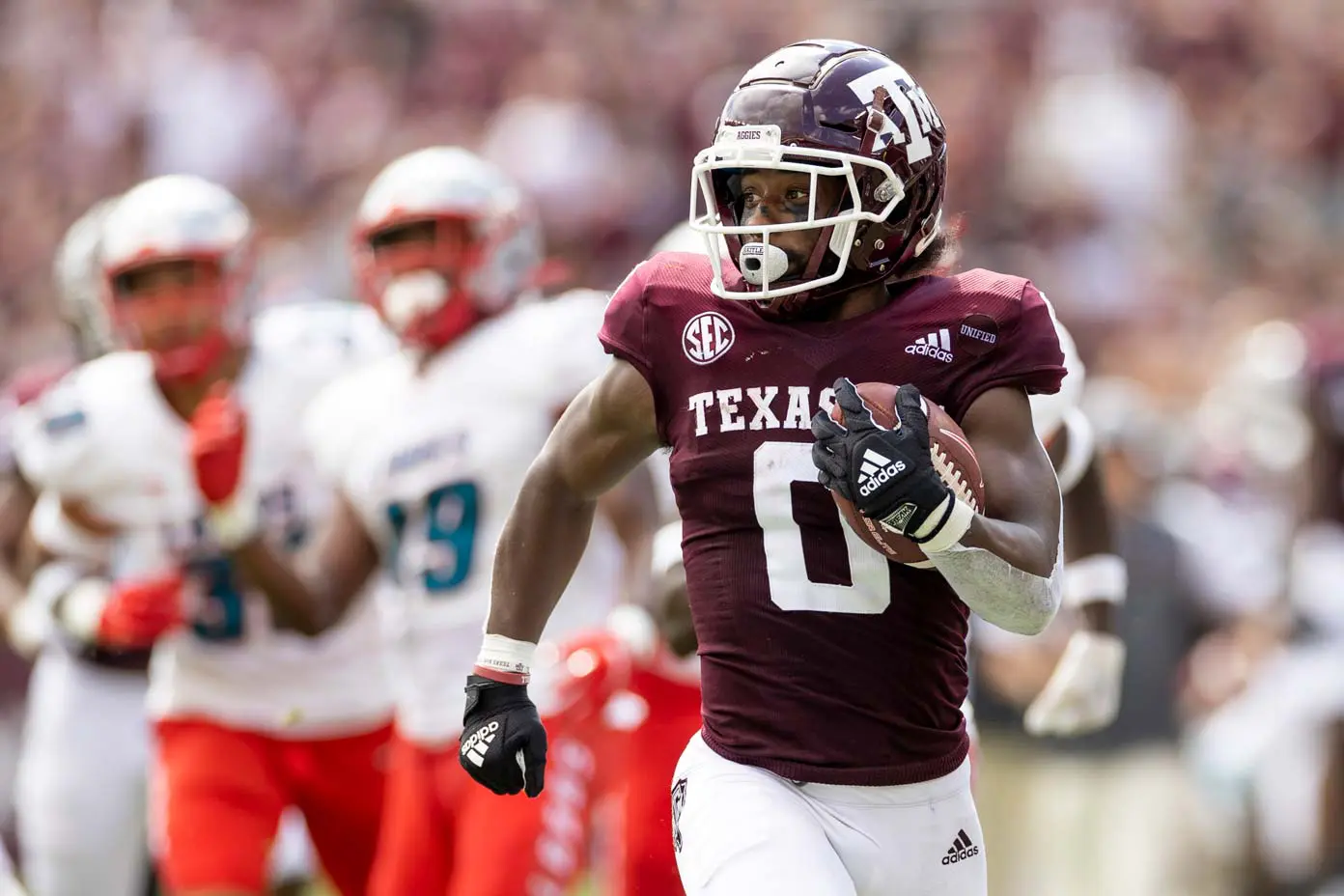 Ainias Smith playing in a football game