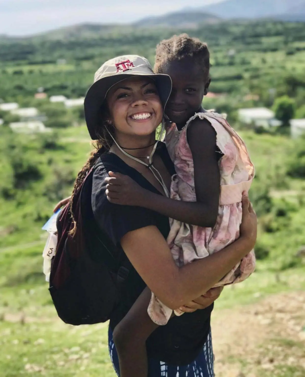 Ally Watt holding a young child