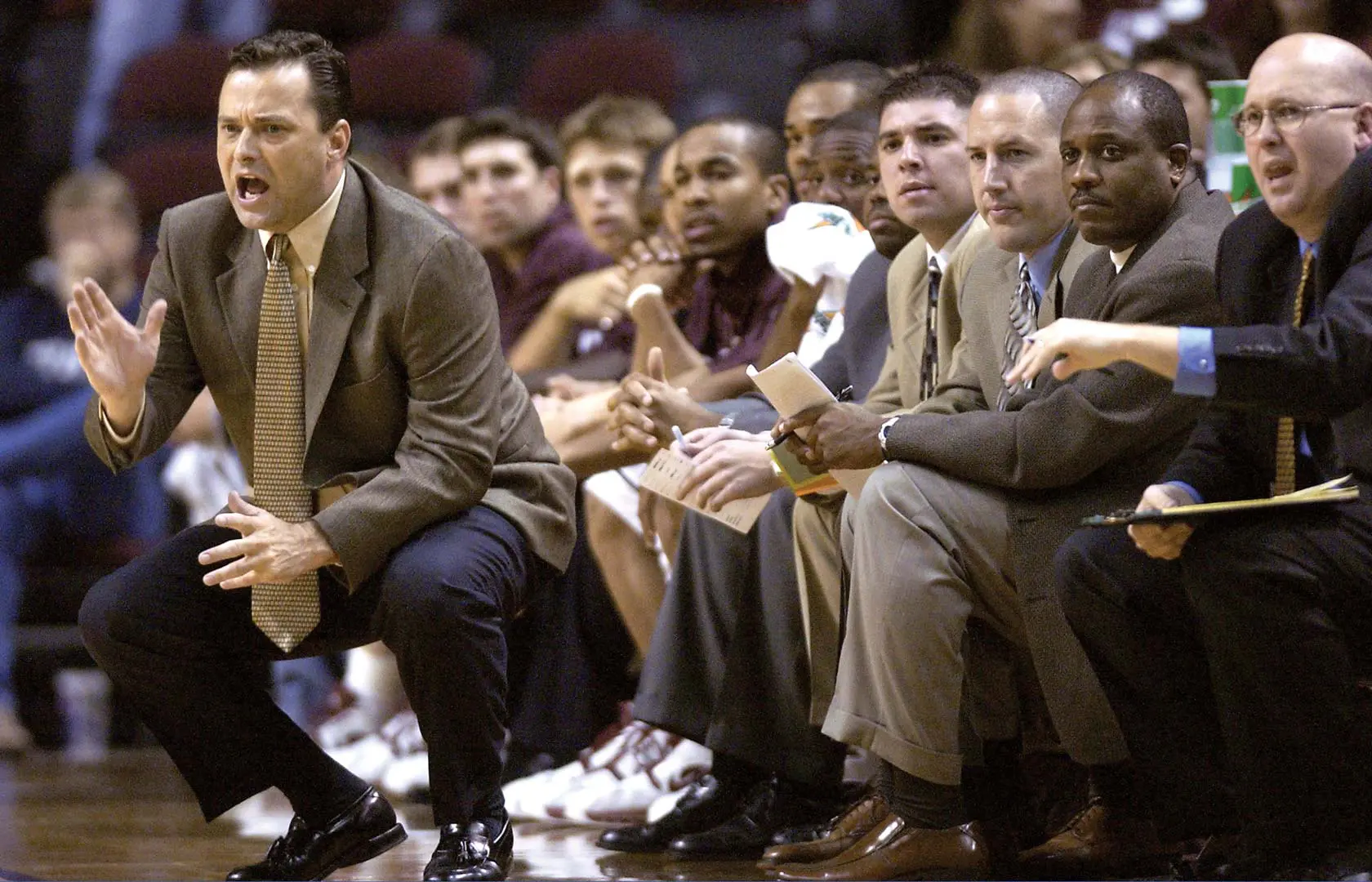 Coaches on the sideline during a game