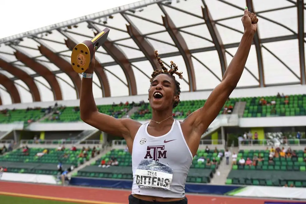 Tyra Gittens celebrating with trophy