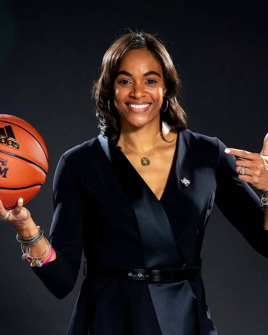 Joni Taylor holding a basketball