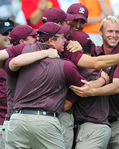 coaches hugging each other