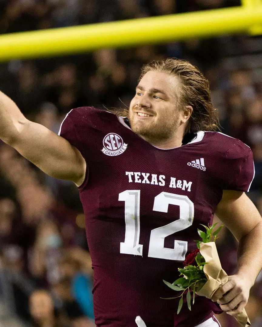 Cullen Gillaspia running off the field and waving