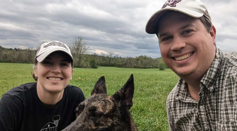 Phil LeFevre with a woman and a dog