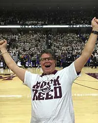 Ed Richards cheering at basketball game