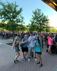 Students waiting outside football stadium