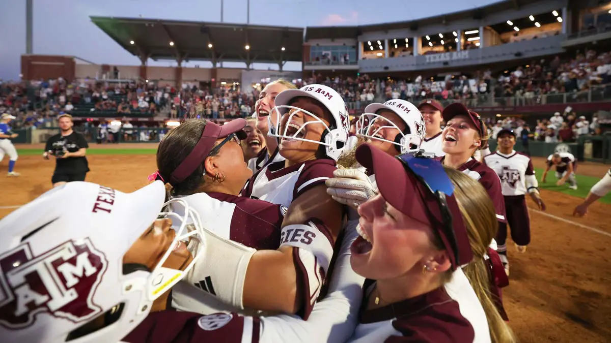 Softball players celebrating